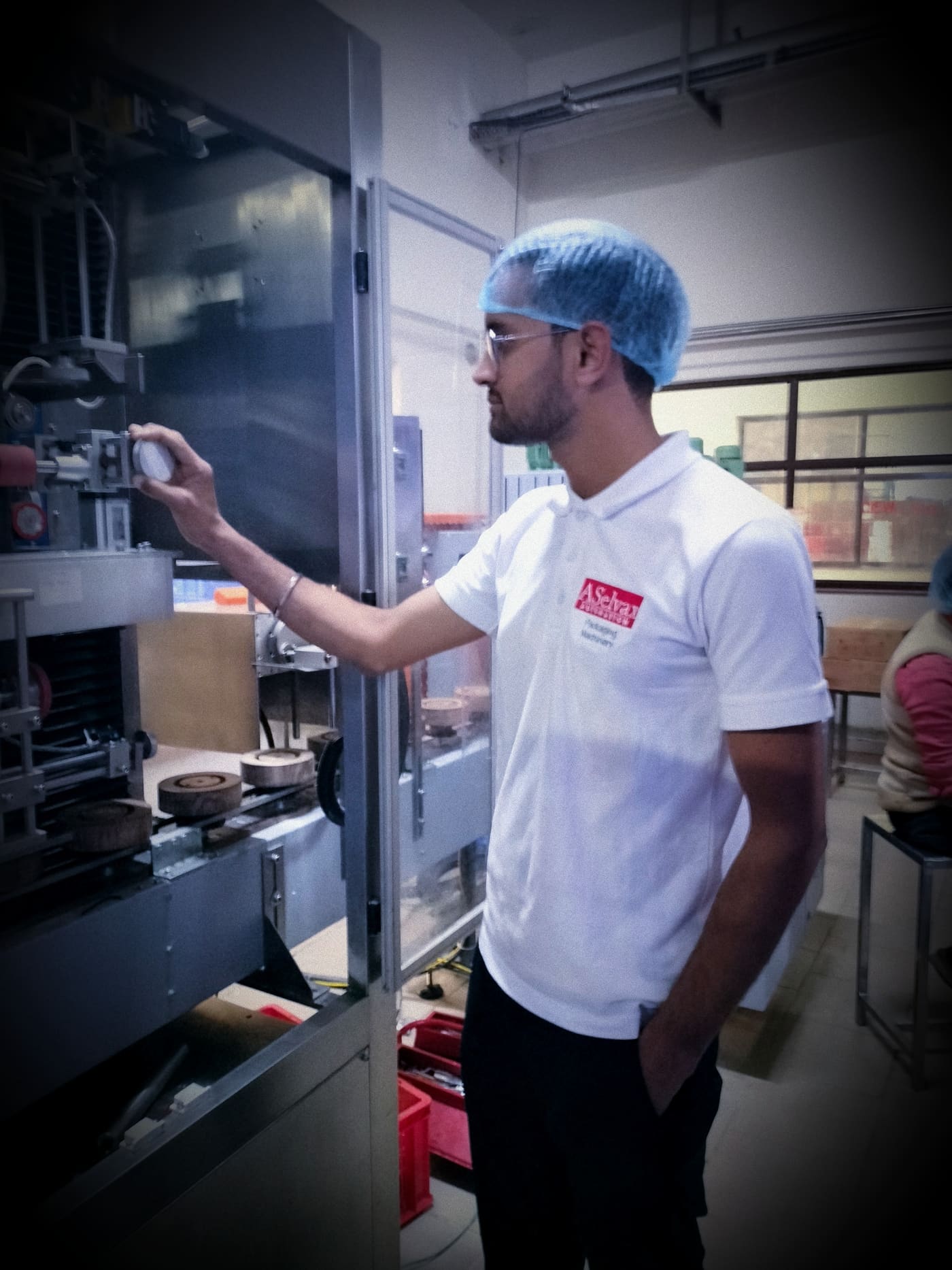 ASelvax Automation staff operating a packaging machine